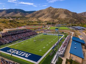 drone photo of marv kay stadium during football game with mount zion in background