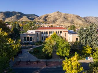 arthur lakes library building in front of foothills in fall