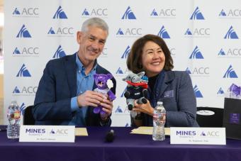 Mines President swaps mascot plushies with ACC president