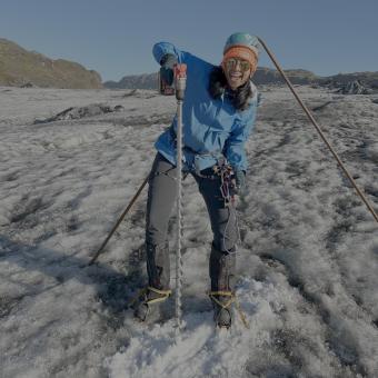 student holding drill on ice