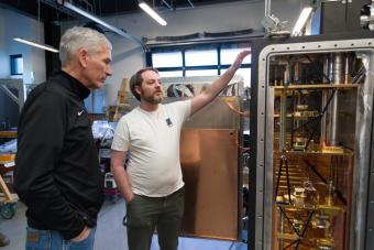 Mines President stands next to Maybell CEO and dilution fridge