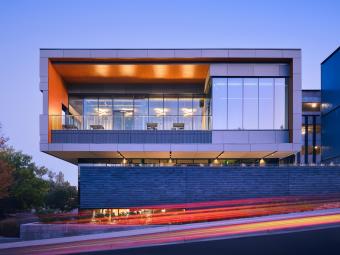 Beck Venture Center at night with motion blur in foreground
