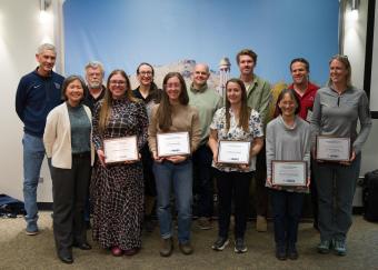 group shot of faculty award winners with Provost Tompkins and President Johnson