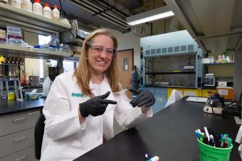 melissa krebs in lab coat holding sample of gelsana dressing