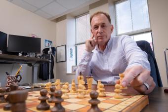 Morgan Bazilian at a chess board