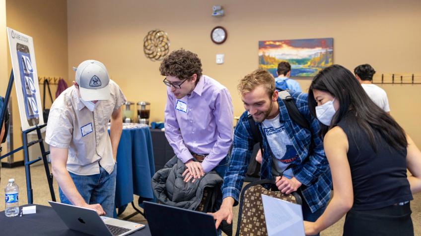 students gathered around computers