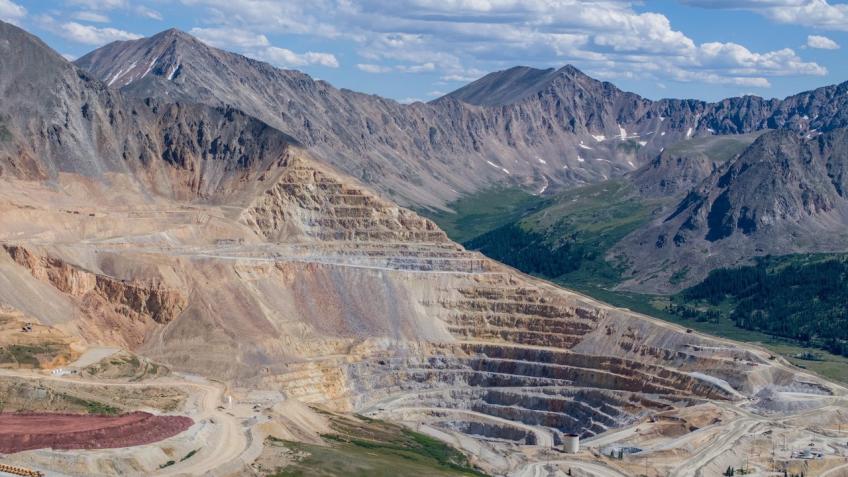 Aerial photo of Climax Mine with white clouds and a blue sky.