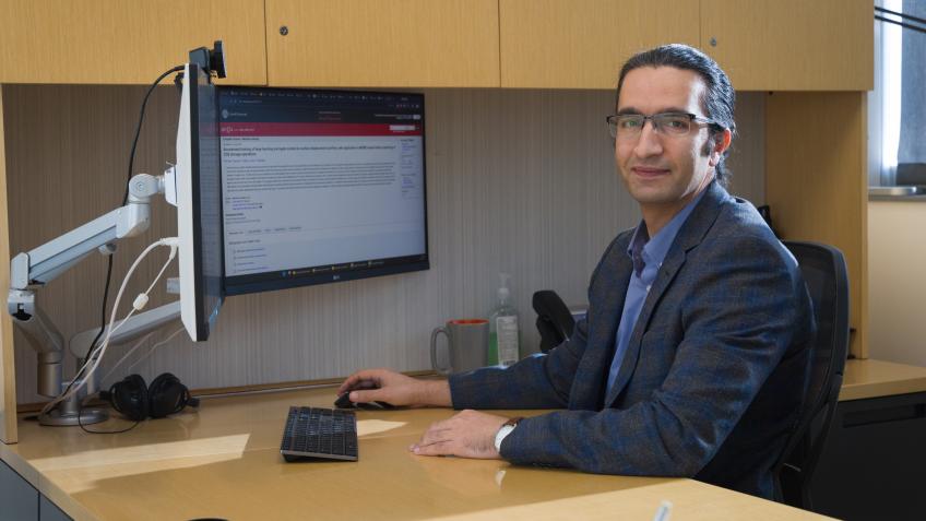 Pejman Tahmasebi at desk