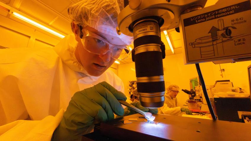 student works in nanofabrication clean room