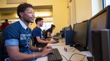 Stock image of Mines students on computers