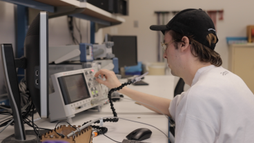 Student works with Sip and Puff device