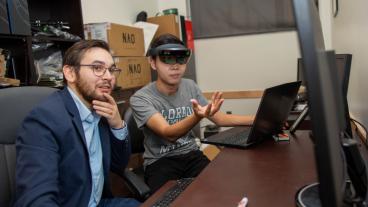 Tom Williams works with a student in Mirror Lab