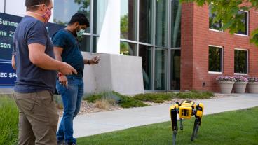 Mines students work with Spot the robot dog