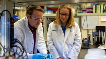 Melissa Krebs, right, looks on as student works with hydrogel bandage material