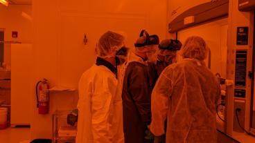 Mines students and faculty working in a clean room