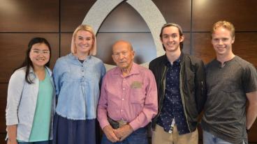 Don Thorson, center, with four students 