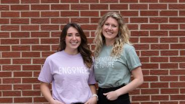 Amanda Field and Claire Knight standing in front of brick wall