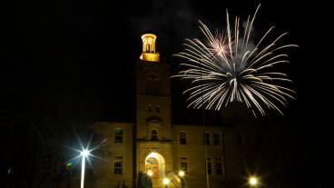 Fireworks explode behind Guggenheim Hall