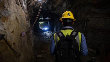 Graduate student operates a robot in Edgar Mine