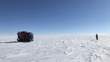 NASA researchers on the surface of the Antarctic Ice Sheet as part of the 88-South Traverse in 2019.