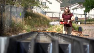 Student researcher working on engineered streambed