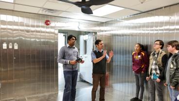 Paulo Tabares in the lab with students