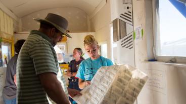 Mines student explains a building material in Mines Tiny House