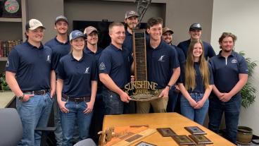 Mines students with Mining Competition trophy