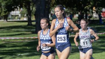 Zoe Baker running at cross country meet