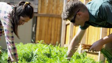 Jamie and Doug Wickler working on the farm