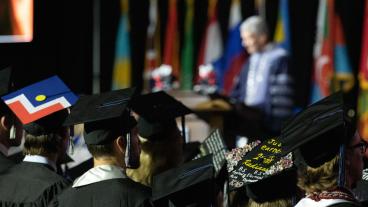 Mines students with decorated caps at commencement