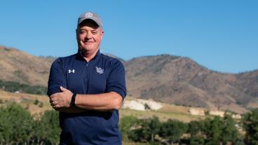 Paul Pastore stands on golf course