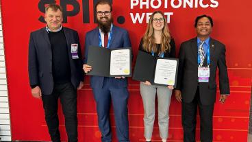 Students posing with award certificates at Photonics West