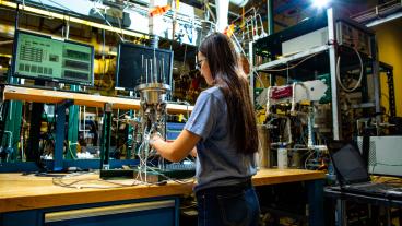 Female student works in fuel cell center
