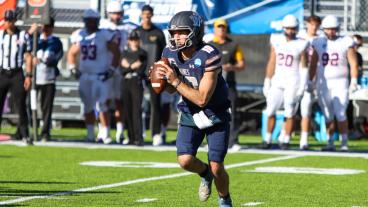 Mines QB John Matocha runs with the football