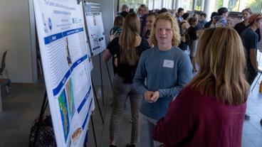 Student shares his research on landslides with a judge