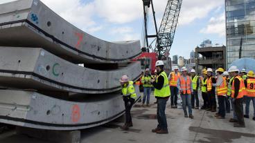 people in vests on a heavy construction work site