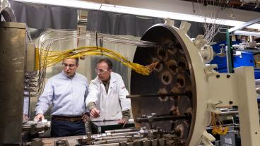 Rob Braun and Neal Sullivan inspect the solid oxide fuel cell system