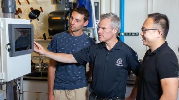 Chris Bellona with students in a PFAS lab at Mines