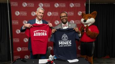 President Johnson and President Brownlee posing with t-shirts