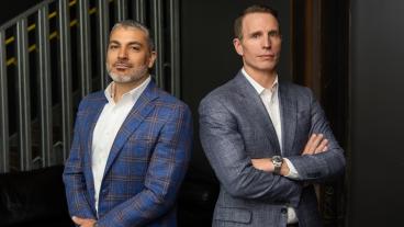 Portrait of Chris Valdez ’00 and Ty Harrison ’98