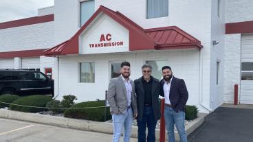 Chris Saykally ’11 and Derek Saykally ’14 outside AC Transmission Total Car Care