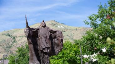 Statue on Mines campus with M behind