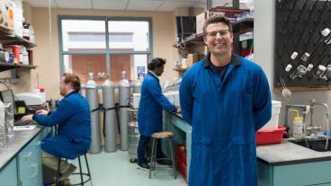 Mike McGuirk in the lab with students