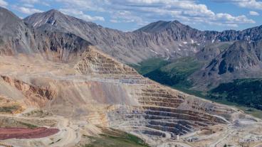 Aerial photo of Climax Mine with white clouds and a blue sky.
