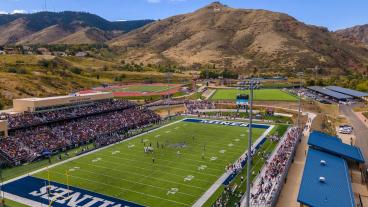 drone shot of marv kay stadium with mount zion in background