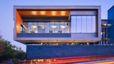 Beck Venture Center at night with motion blur in foreground