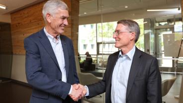 paul johnson and jud virden shake hands