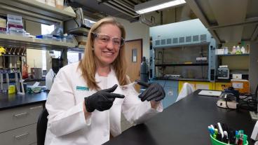 melissa krebs in lab coat holding sample of gelsana dressing