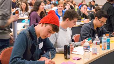 Mines students sit in classroom rows during Innovation Challenge presentation